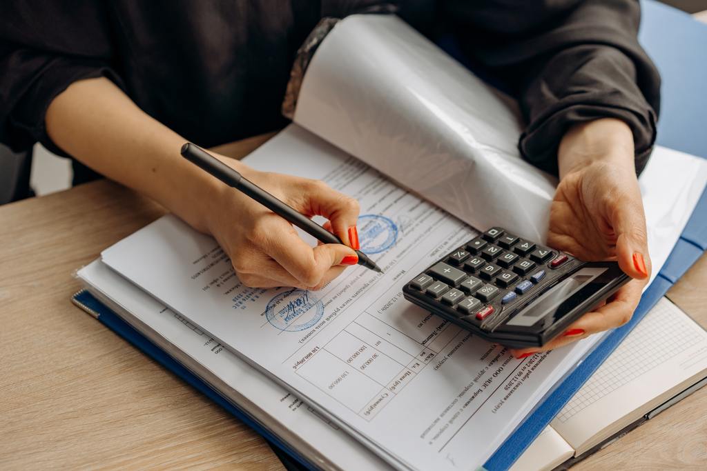 an accountant working with a calculator